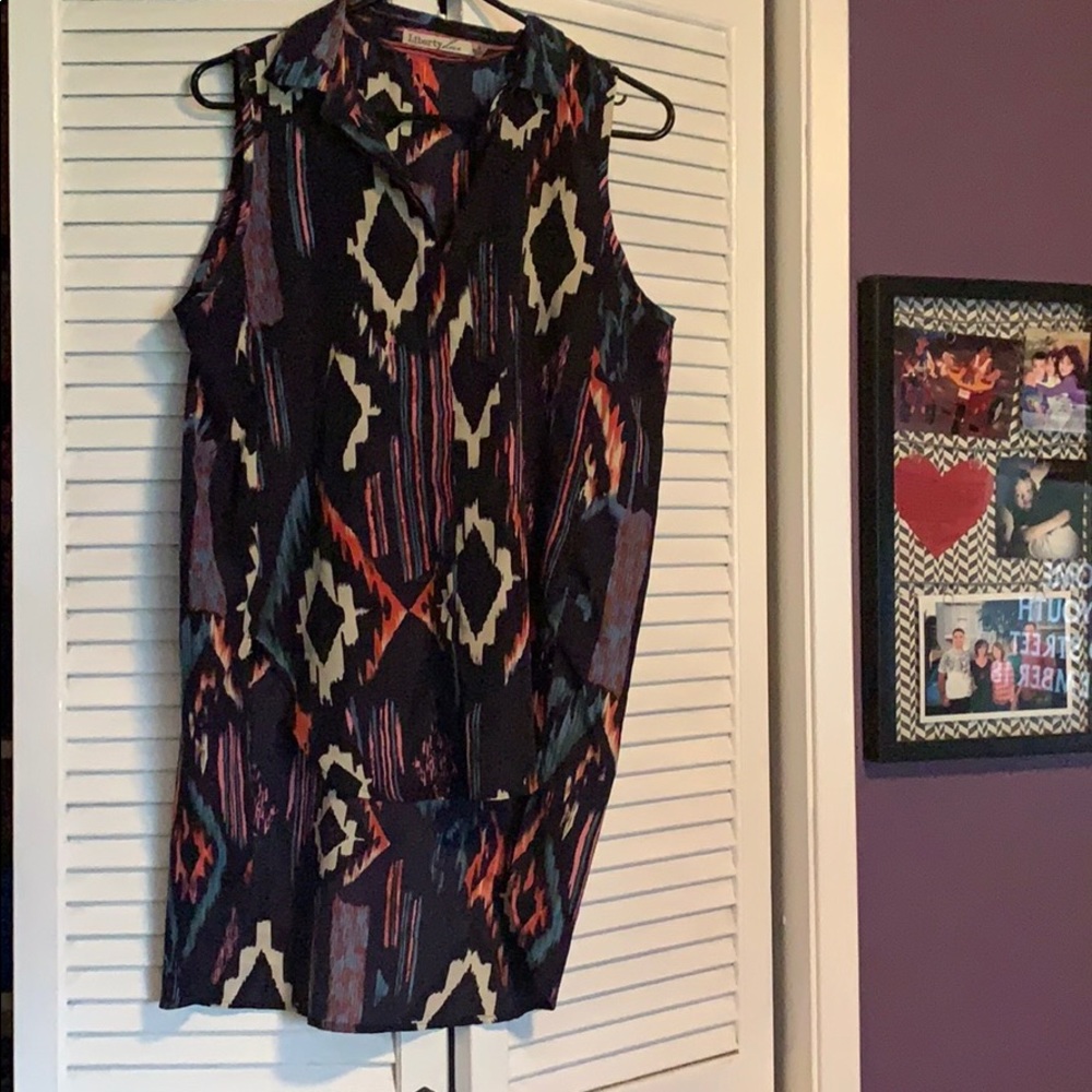 High low tribal print sleeveless button up !!